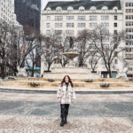 Girl standing in front of building on Upper East Side NYC